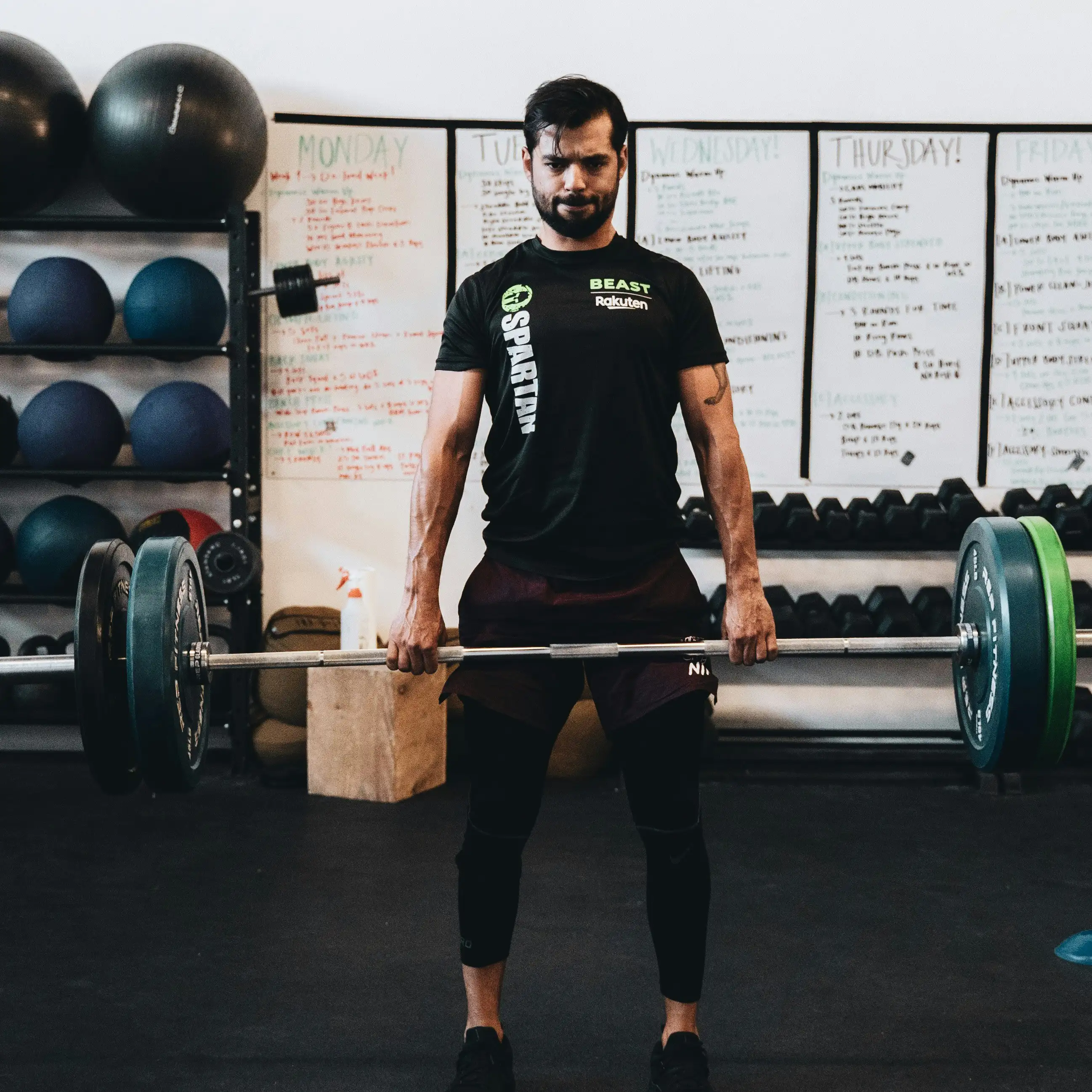 man lifting barbell